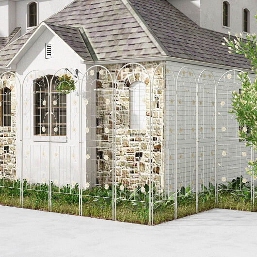 Decorative metal trellis with lights in front of a house