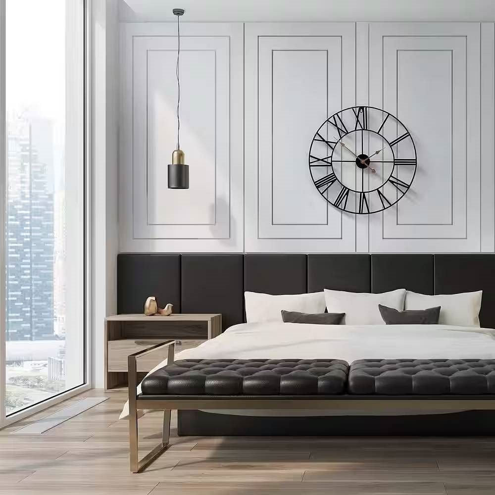 Modern bedroom with a large clock on the wall above a bed.