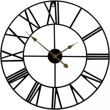 Black wall clock with Roman numeral markers on a white background