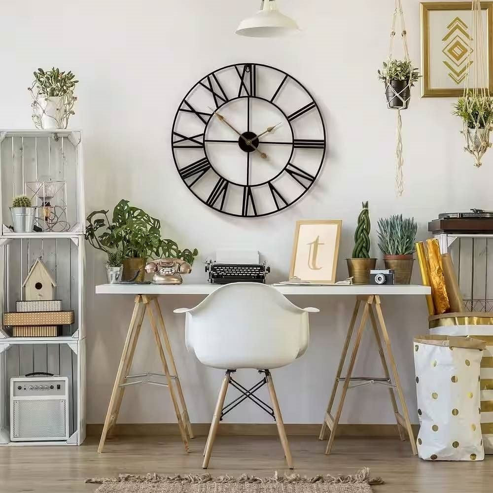 Modern home office with a large wall clock, desk, chair, and decorative items.