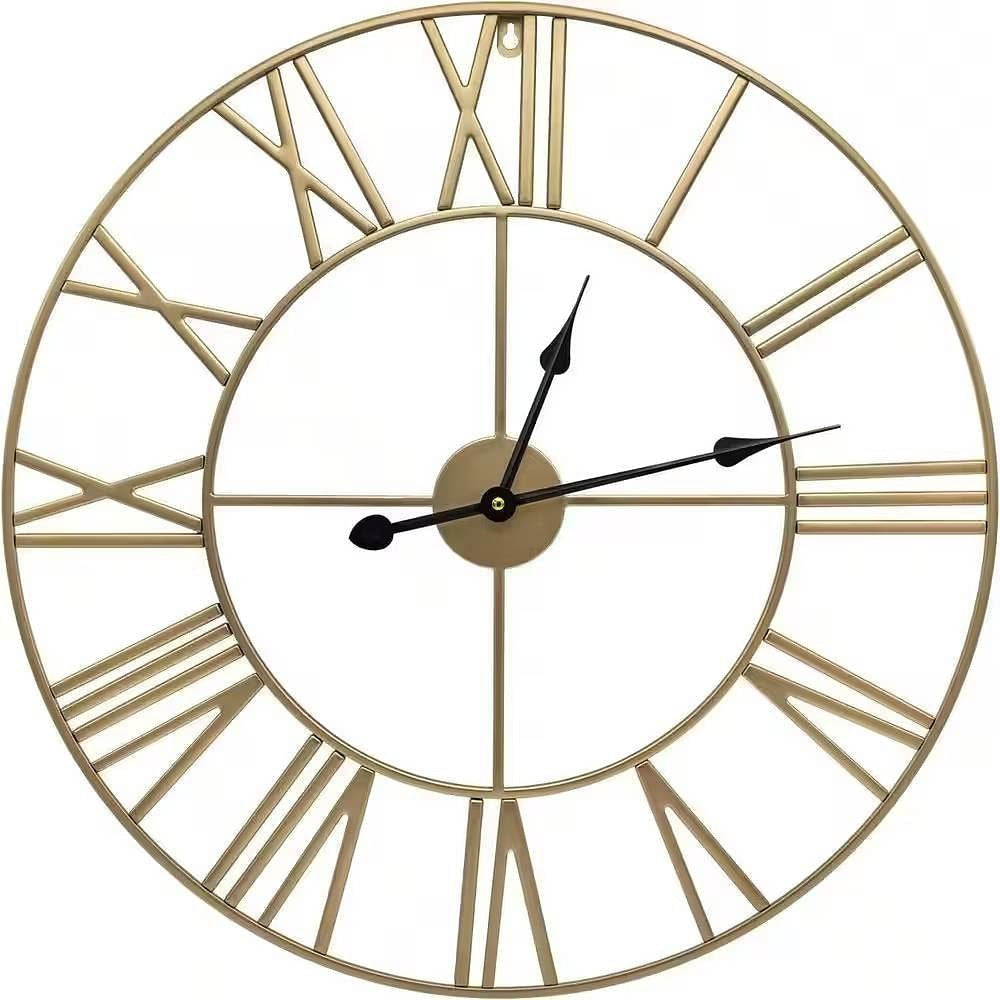 Gold wall clock with Roman numerals on a white background