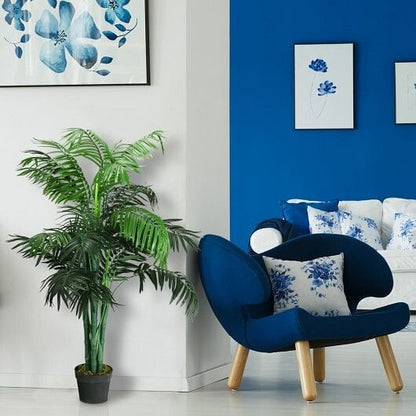 Modern living room with blue armchair, white sofa, and floral decor.