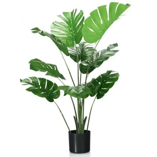 Artificial potted plant with large green leaves on a white background