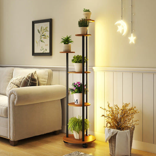 Decorative plant stand with plants in a living room setting