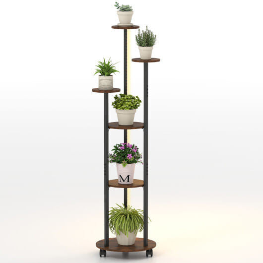 Tall, multi-tiered plant stand with various potted plants on a white background