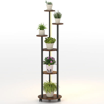 Tall, multi-tiered plant stand with various potted plants on a white background