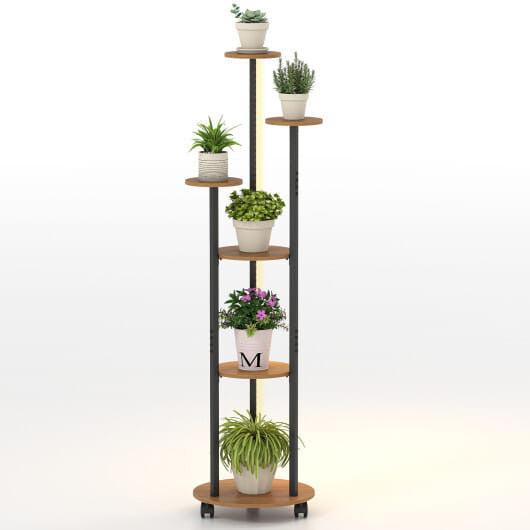 Tall plant stand with multiple shelves holding potted plants on a white background