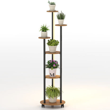 Tall plant stand with multiple shelves holding potted plants on a white background