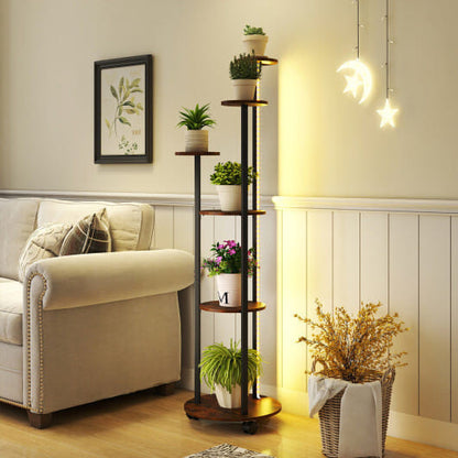 Living room with a sofa, plant stand, and decorative items