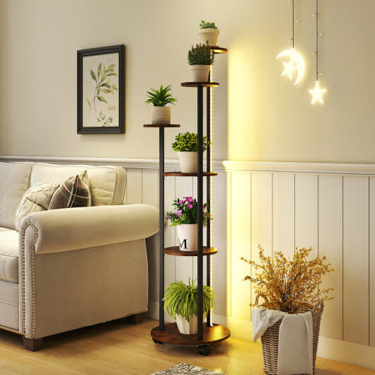 Living room with a sofa, plant stand, and decorative items