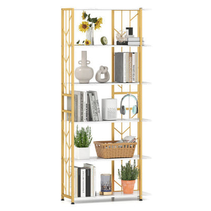 Gold metal bookshelf with decorative items on a white background