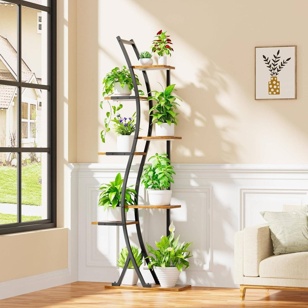 Tall, multi-tiered plant stand with various potted plants in a living room setting.