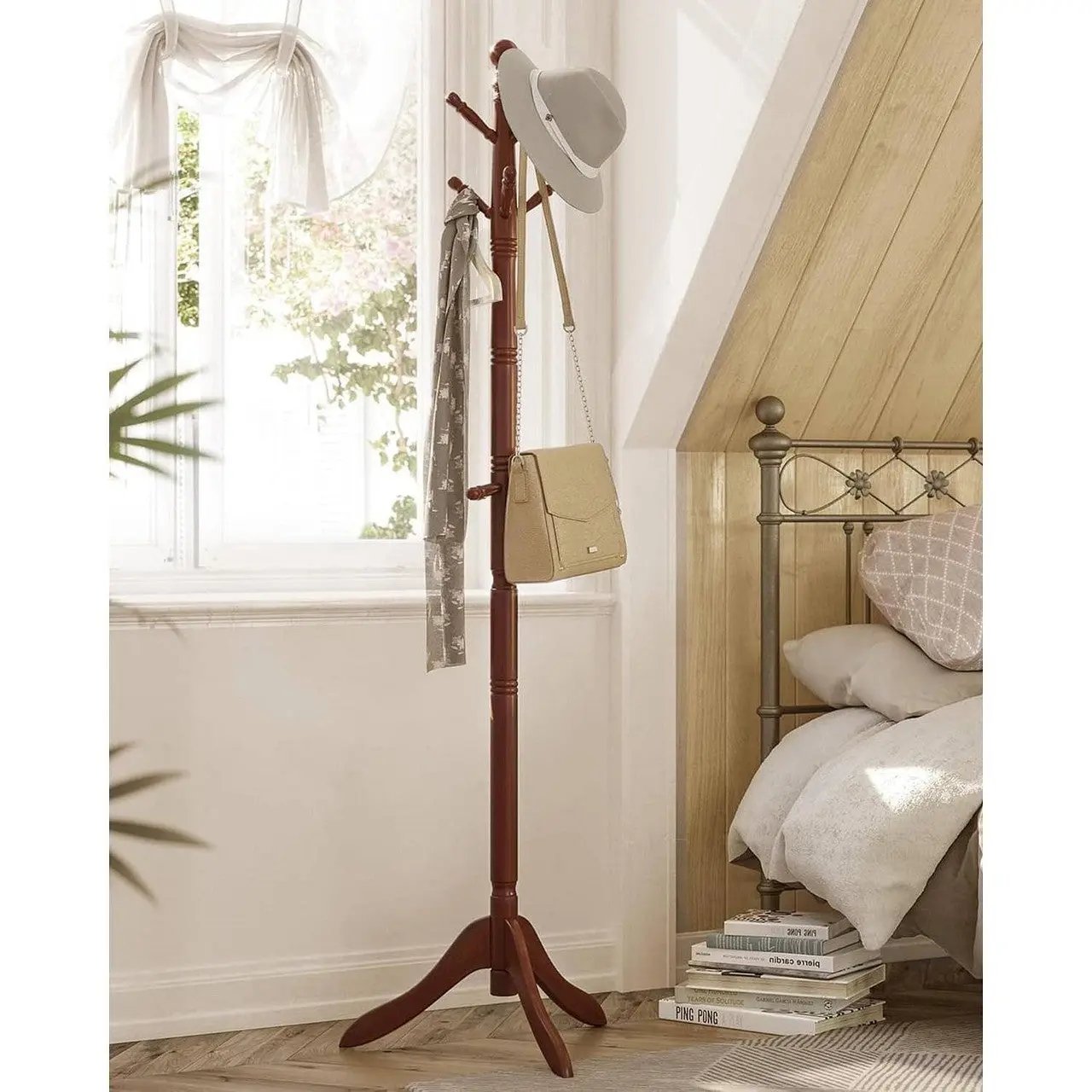 Wooden coat rack with a hat and bag in a bedroom setting