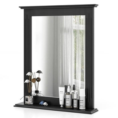 Black-framed mirror with decorative items on a white background