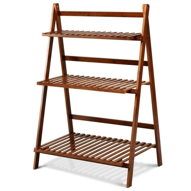 Wooden shelf with three tiers on a white background