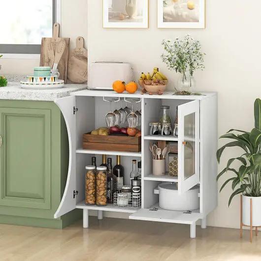 Kitchen cabinet with open doors displaying various kitchen items in a well-lit kitchen.