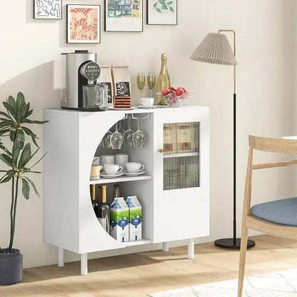 White bar cabinet with glass doors in a room setting with decor elements.