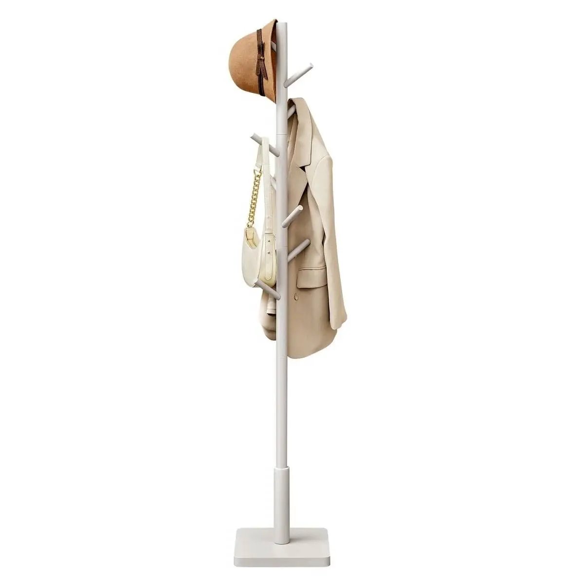 White coat stand with a beige coat, brown hat, and handbag on a white background