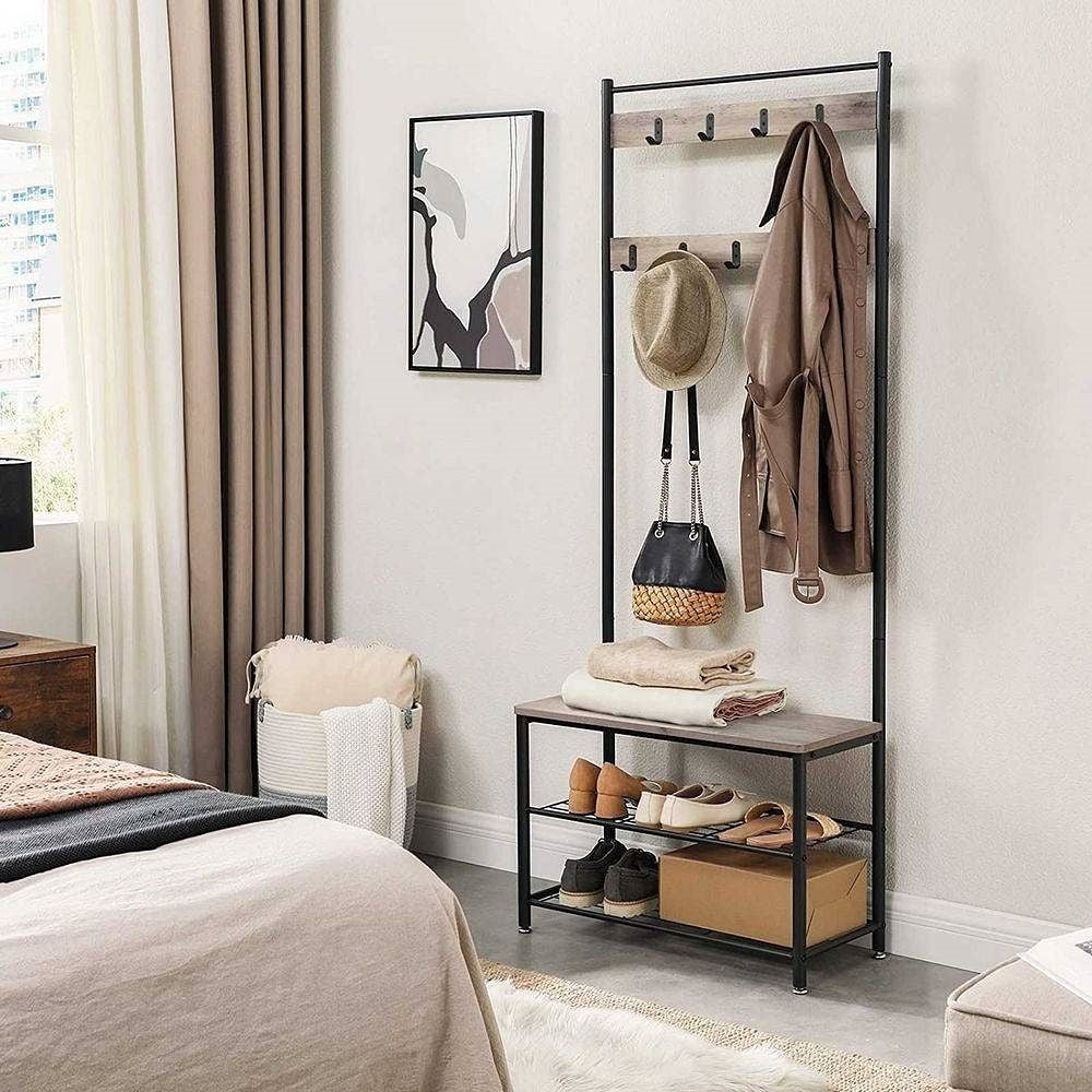 Clothing rack with shoes and bags in a bedroom setting