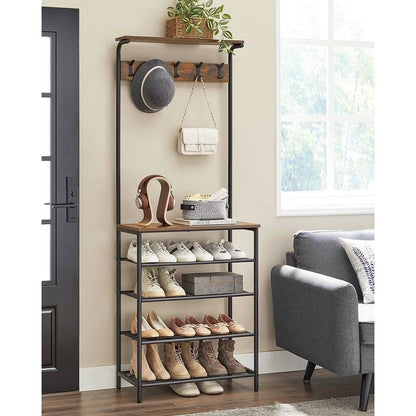 Shoe rack with shoes and accessories in a room with a gray armchair and window.