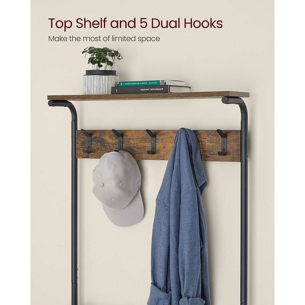 Wall-mounted coat rack with top shelf and dual hooks, holding a cap and jacket.