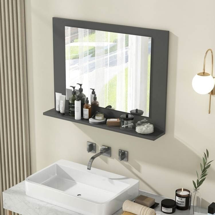 Bathroom setup with a sink, mirror, and various toiletries.