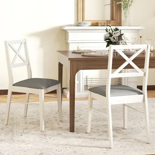 Dining table with two chairs in a room setting