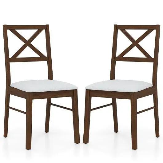 Two wooden chairs with white cushioned seats on a white background
